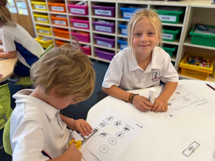 May be an image of child, studying and text