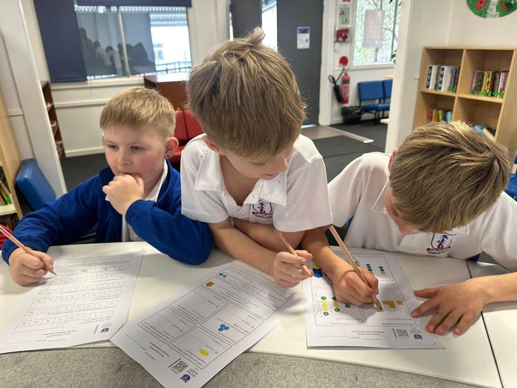 May be an image of 3 people, people studying and text